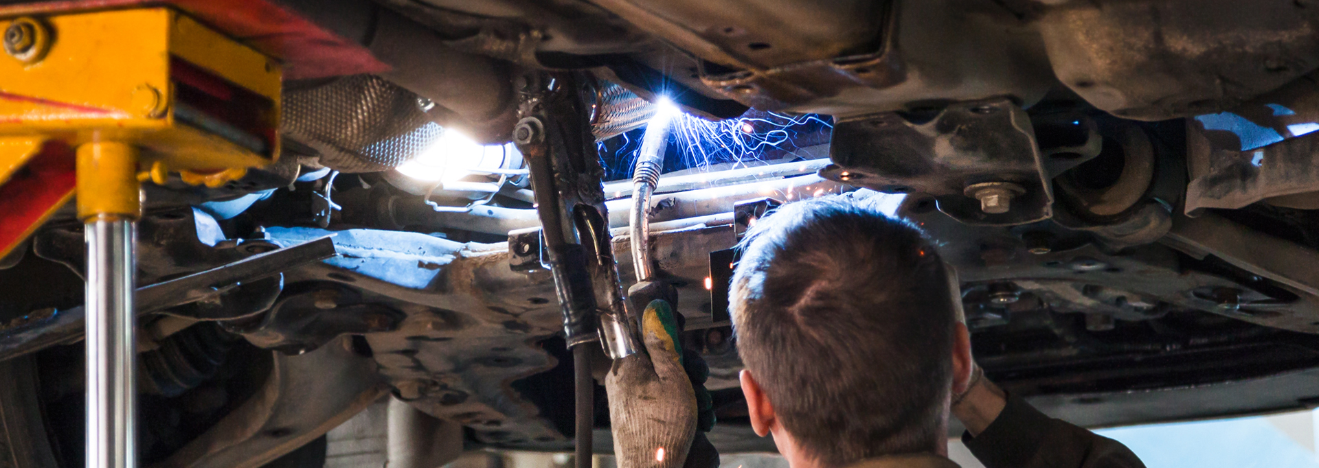 Mechanic welding a vehicle - Car Repairs Wrexham